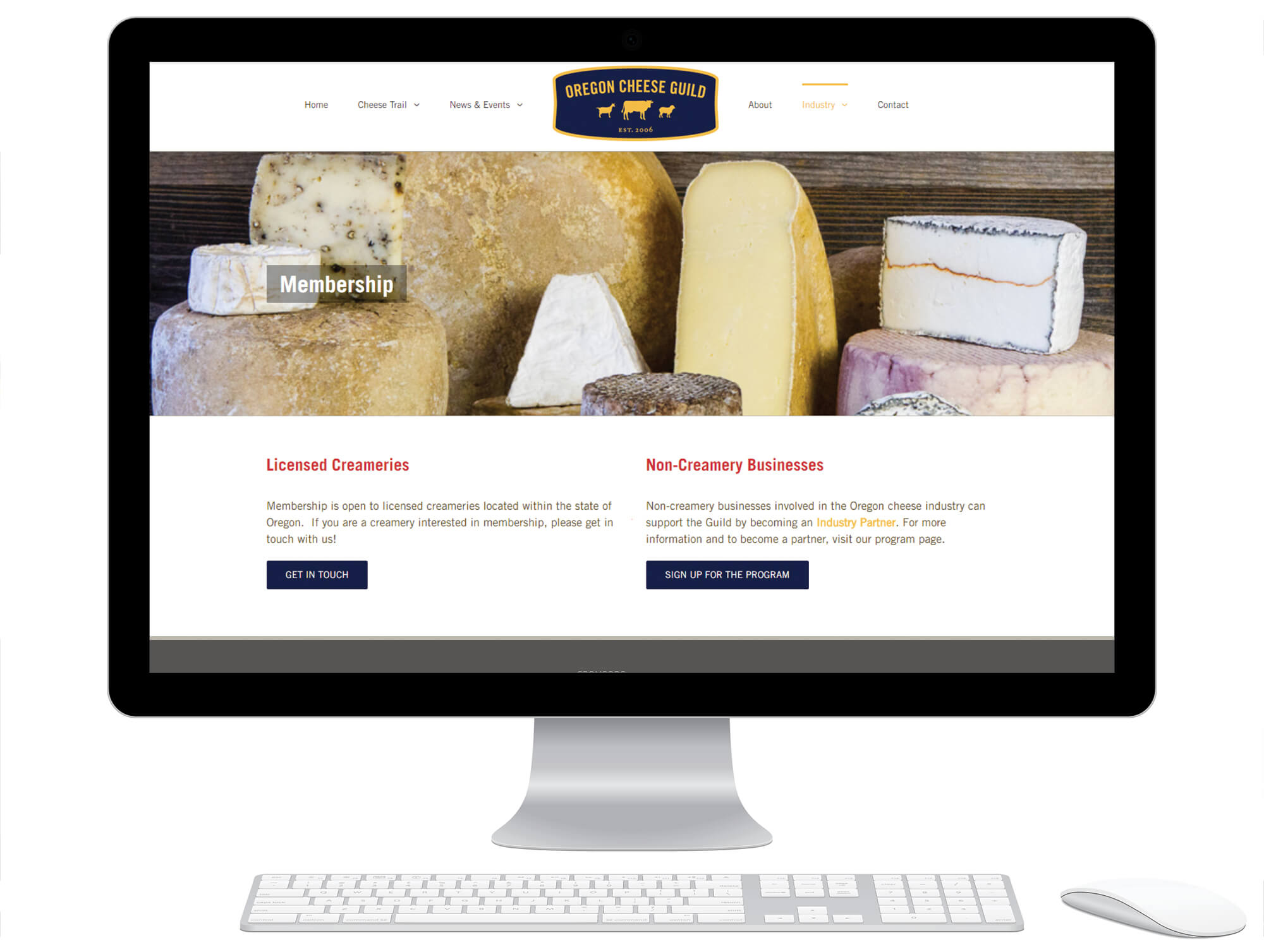 Desktop computer displaying the membership page of the Oregon Cheese Guild website